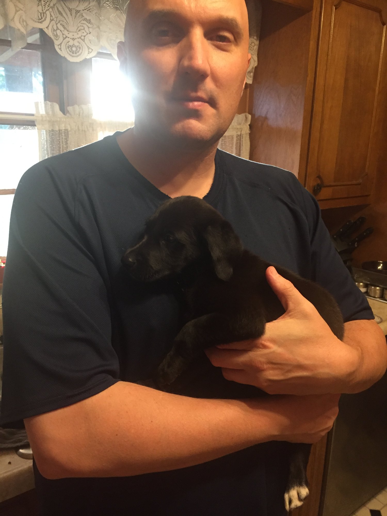 John Wiley at home with his dog
